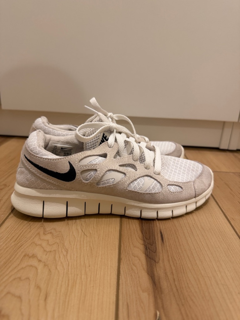 Nike White & Light Gray Athletic Sneakers with Black Swoosh